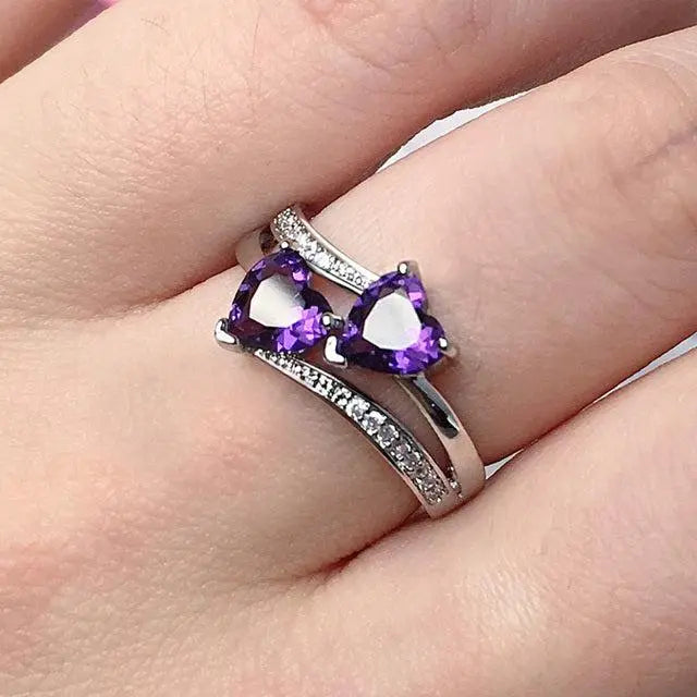 Stylish ring with purple crystal in silver
