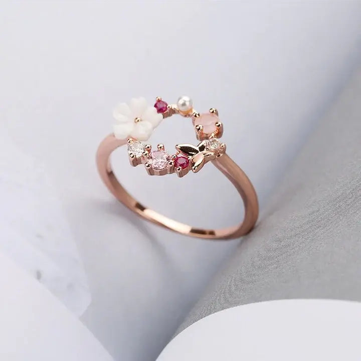 Floral ring with pink cubic zirconia in gold