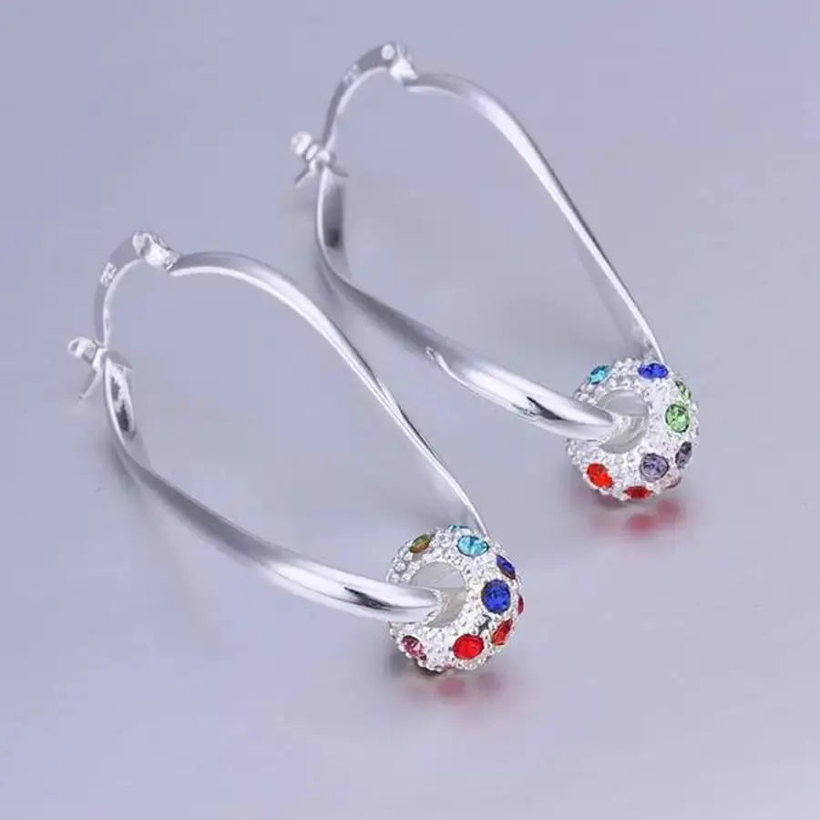 Multicolored earrings with beads in shining silver