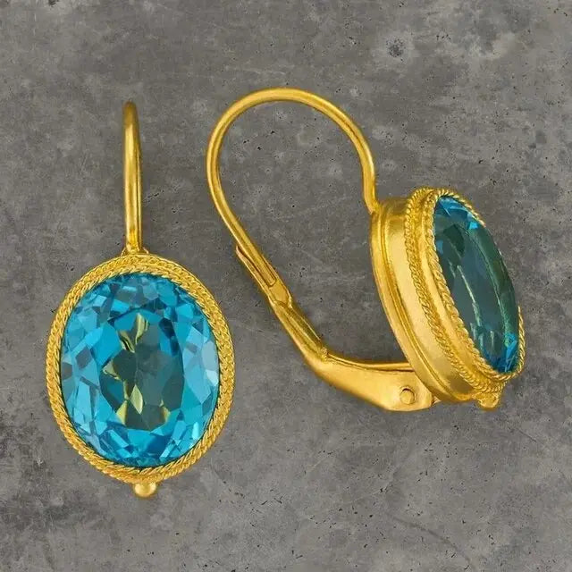 Vintage earrings made of blue crystal in gold