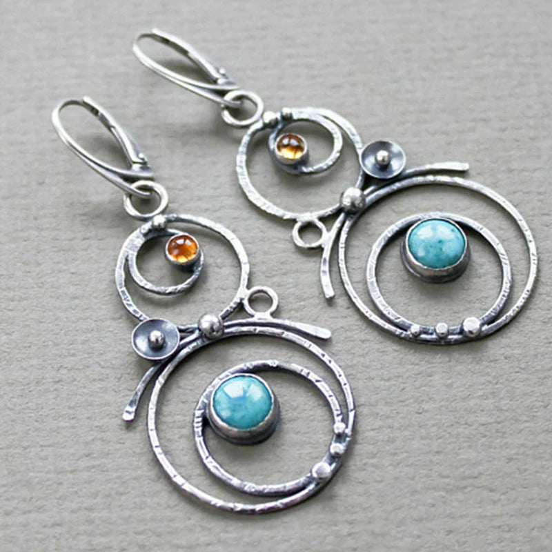 Earrings with blue and orange stones