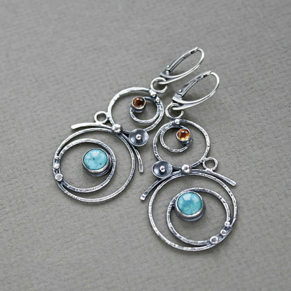 Earrings with blue and orange stones