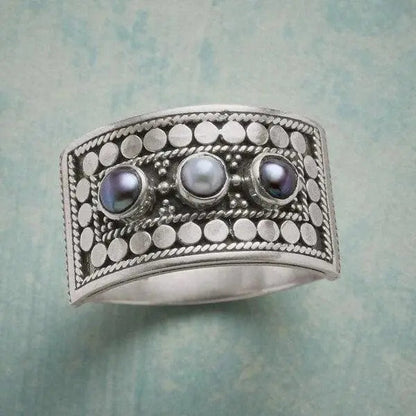 Geometric Ring with Carved Pearl and Three Stones