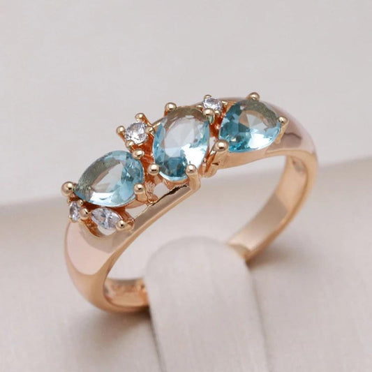 Gold ring with blue zirconia stones