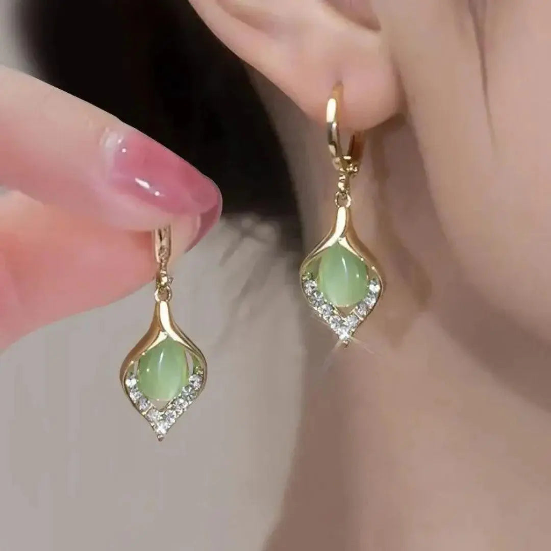 Elegant earrings with sparkling green crystals