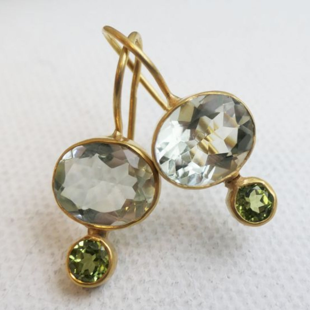 Gold earrings with green crystals