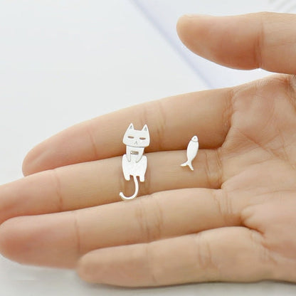Silver earrings with fish and climbing cat