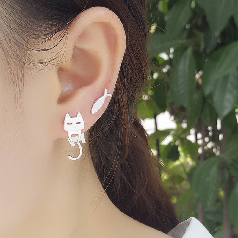 Silver earrings with fish and climbing cat