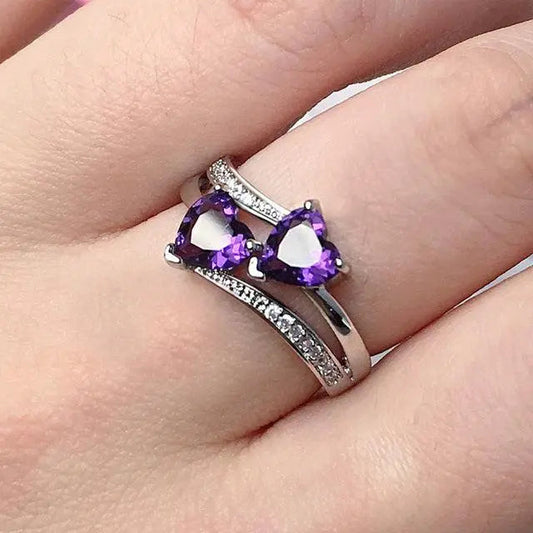 Stylish ring with purple crystal in silver