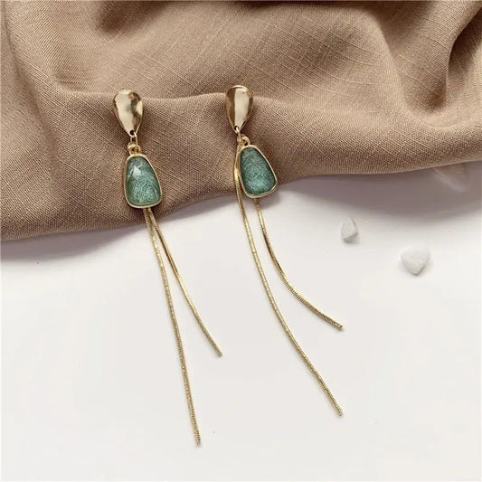 Gold earrings with turquoise stone