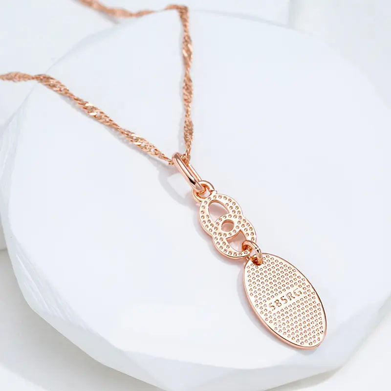 Gold-plated necklace with a shiny tip