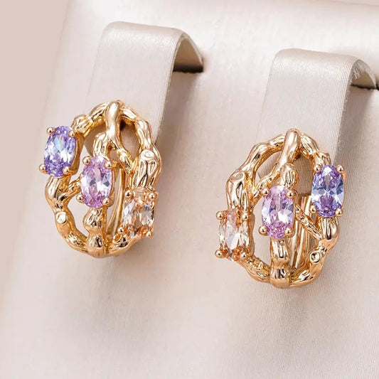 Exotic elegant earrings made of gold and multicolored stones