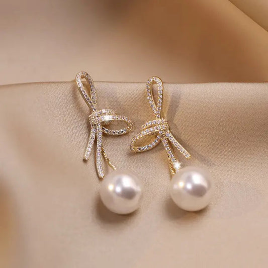 Gold Pearl Earrings with Shiny Bow