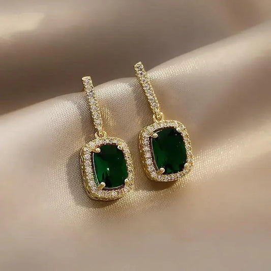Elegant earrings with shiny green crystals