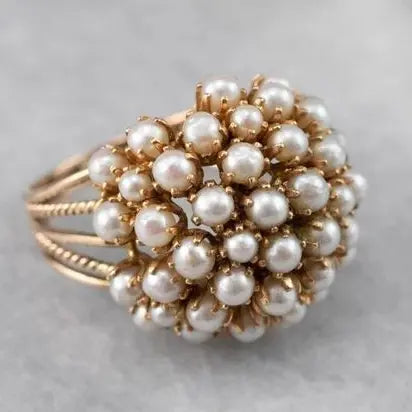 Ring with inlaid pearls