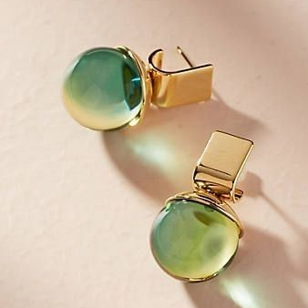 Stylish gold earrings with green crystal