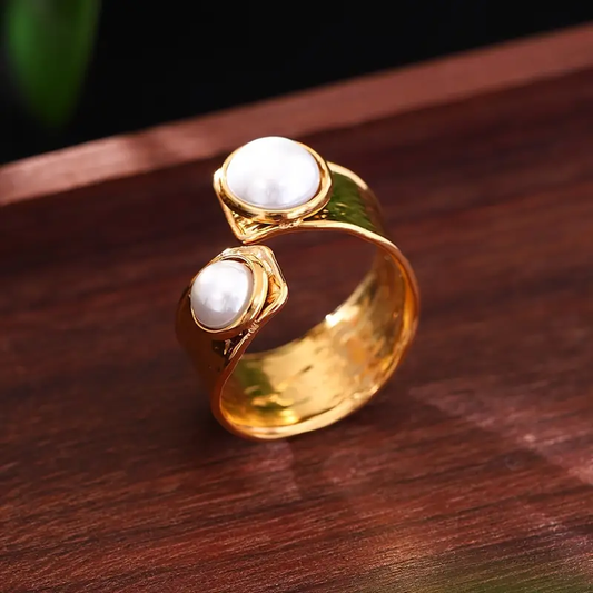 Open gold ring with two pearls