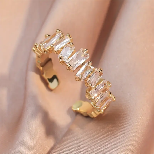 Gold ring with white glass crystal